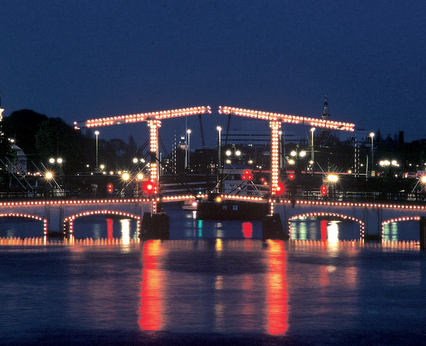 The central span of the Magere Brug, the Skinny Bridge, in Amsterdam, Where Jakob, Coby, kissed Mooi, a part of the soul of Damsko, and where a kiss is eternal